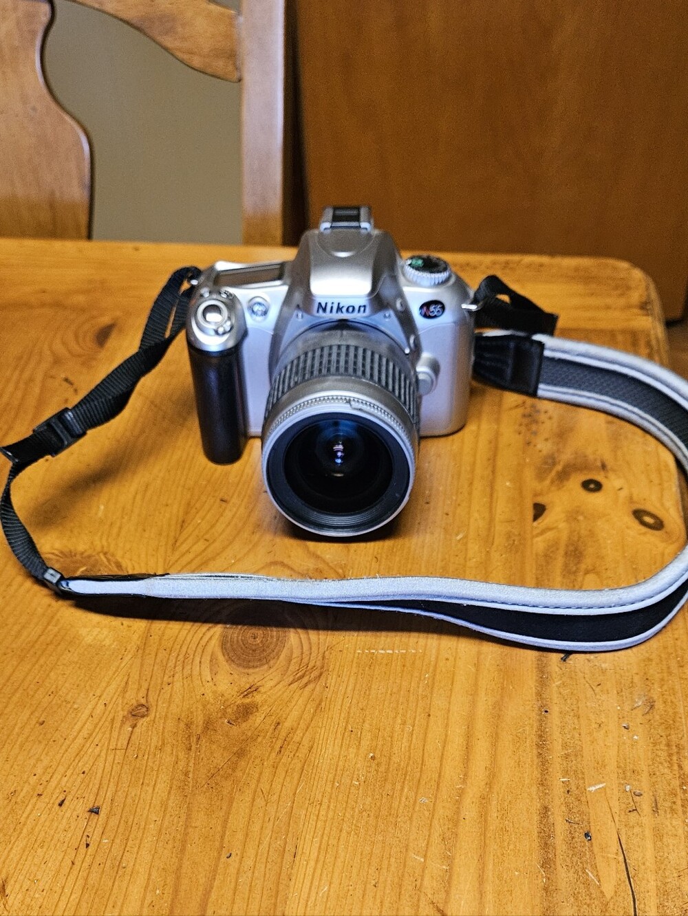 Nikon N55 35mm SLR Film Camera with Black Zoom Lens and Strap